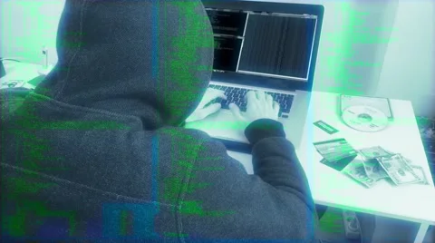 Source Code Hooded Hacker Working On A Computer Stock Footage