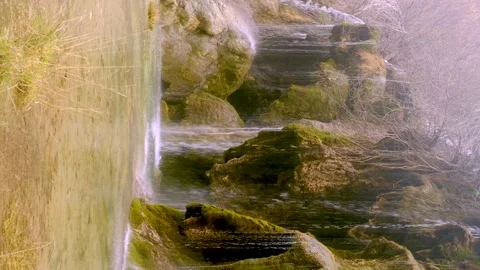 Source of river from filtered waters of the waterfalls falling from the cascade Stock Footage 178094393