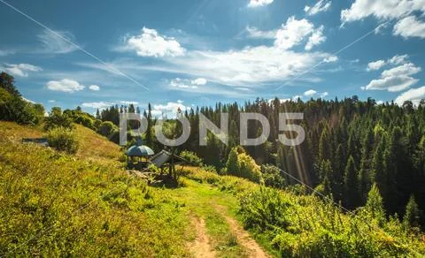 Source with spring water and an arbor on a hill slope ~ Hi Res #108340888