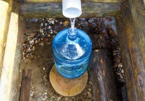 Source of spring water bottle Stock Photos