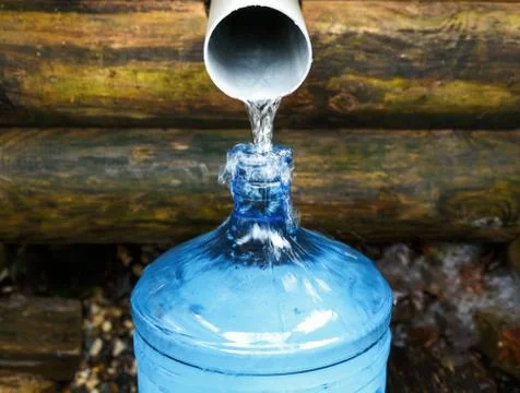 Source of spring water bottle Stock Photos