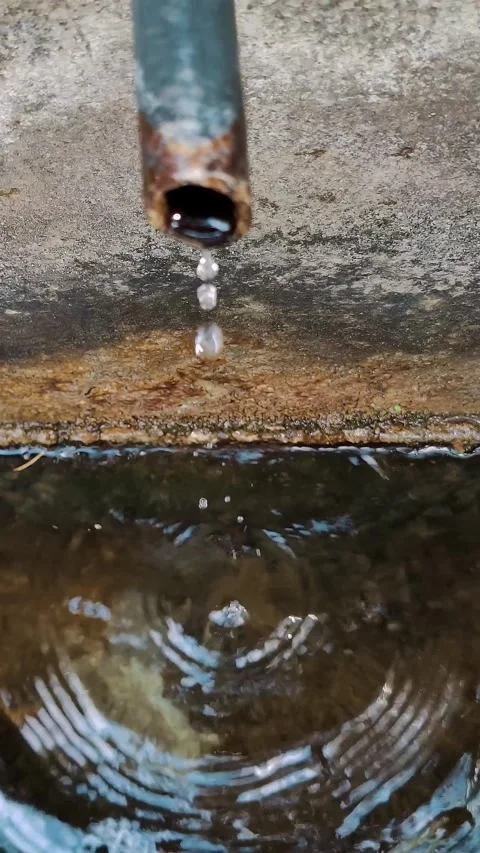 Source of spring water from a metal tap. Close-up. Top view. Drinking water Stock Footage 310797721