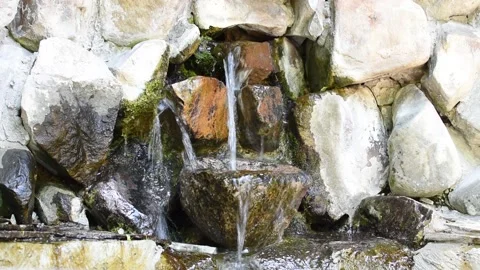 The source is from the stone wall. Stock Footage 198388354