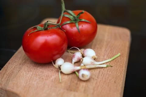 Source of vitamins garlic and tomatoes Stock Photos