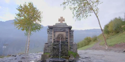 Source of water in mountain area with cross Stock Footage 277193811