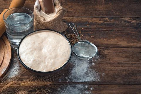 The sourdough for bread is active. Ingredients for making bread. Stock Photos