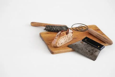 Sourdough bread and baking tools on bread board Stock Photos