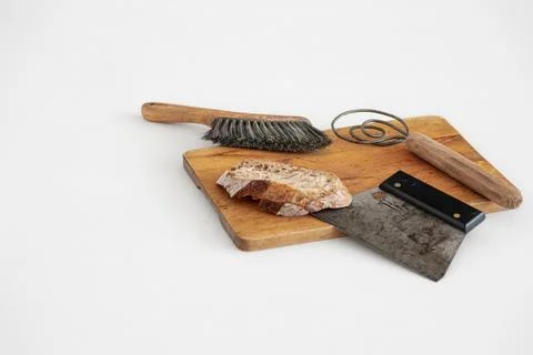 Sourdough bread and baking tools on bread board Stock Photos