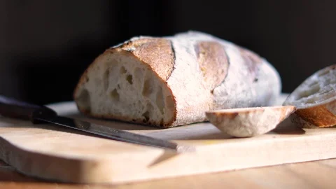 Sourdough Bread And Knife On A Cutting Board Stock Footage 128306987