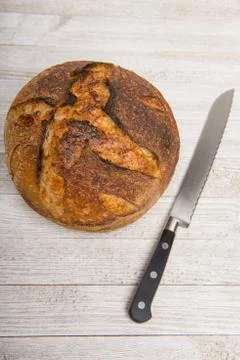 Sourdough bread with bread knife Stock Photos