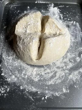 Sourdough Bread Dough on Baking Sheet, Scored with Cross Stock Photos
