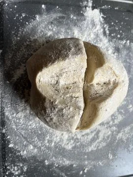 Sourdough Bread Dough on Baking Sheet, Scored with Cross Stock Photos