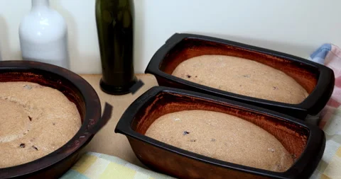 Sourdough bread during rise time in clay moulds. Timelapse dough rise motion. Stock Footage 278410395