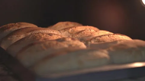 Sourdough breads cooking in the oven. Stock Footage 240445430