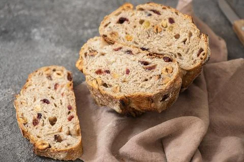 Sourdough fruit bread with dried apricots, cranberries and hazelnuts. Stock Photos