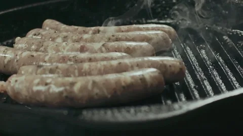 Sousages frying in the pan Stock Footage 76602414