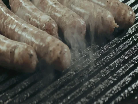 Sousages frying in the pan Stock Footage 76602419