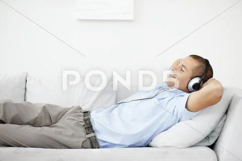 South Africa, Man Relaxing While Listening Music