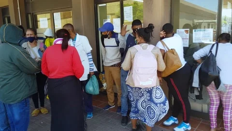 South Africa Sassa Bellville Long queue with no social distancing Stock Footage