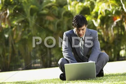 South American businessman typing on laptop Stock Photos
