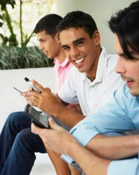 South American men using cell phones Stock Photos