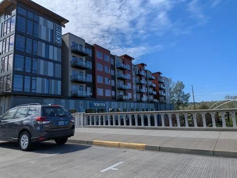 South Block mixed-use development beside riverfront bridge showcases Stock Photos