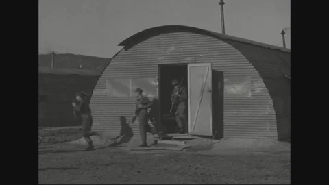 SOUTH KOREA - 1956: Hut threshold - Serviceman steps down from camp quarters Stock Footage 344500736