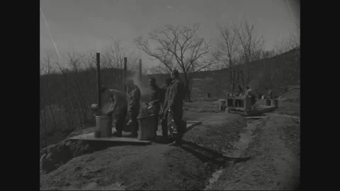 SOUTH KOREA - 1956: Soldier queue - Steam rises beside a hillside washing line Video stock 344500752