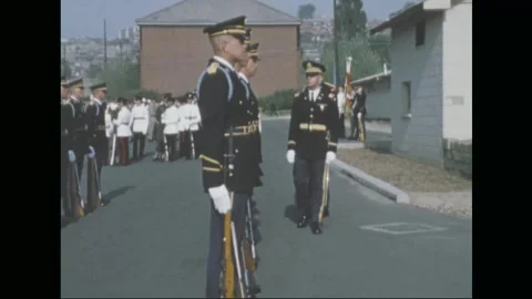 SOUTH KOREA - 1970: Command ceremony - officers confer by the colour party 库存影片 343936237