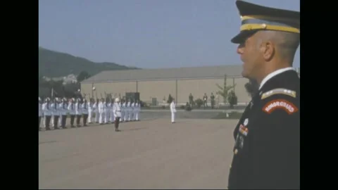 SOUTH KOREA - 1970: Command parade review - officers watch the formation Stock Footage 343936299