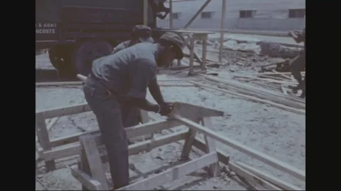 SOUTH KOREA - 1977: Construction yard - Engineer carpentry outdoors Vidéo 343940486