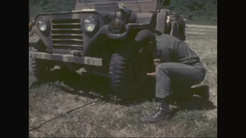 SOUTH KOREA - 1977: Jeep maintenance - Crews work across motor pool Stock Footage 343932353