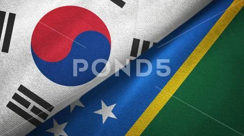 South Korea and Solomon Islands two flags textile cloth, fabric texture Stock Photos