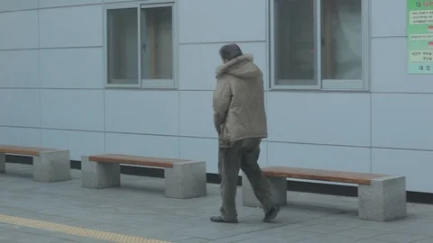 South Korea view of platform from moving train slowly leaving station Stock Footage 100595155