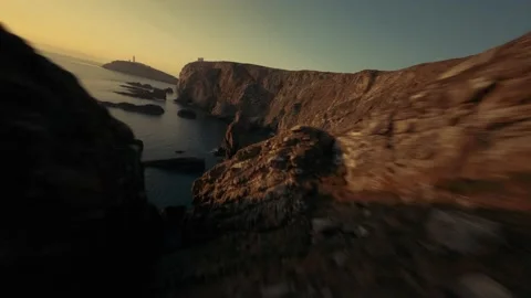 South Stack lighthouse shot during sunset with a beautiful coast line Stock Footage