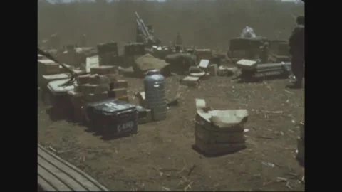 SOUTH VIETNAM - 1970: Sorting - Crates and cans cover a firebase supply dump Stock-Footage 344482928