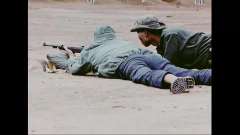 SOUTH VIETNAM - 1971: Range practice - Prone riflemen train along firing line Stockbeeldmateriaal 344485477