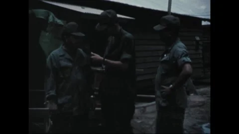SOUTHEAST ASIA - 1969: Field interview - Microphone held under a shed roof 库存影片 344005330