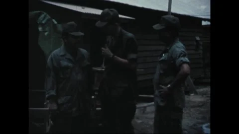 SOUTHEAST ASIA - 1969: Field interview - Reservist raises mic to his face Stock Footage 344005331