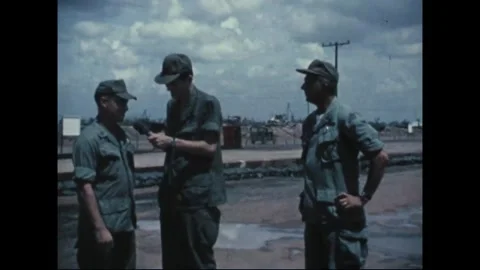 SOUTHEAST ASIA - 1969: Roadside interview - Utility vehicle behind the group 库存影片 344005437