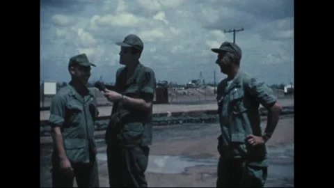 SOUTHEAST ASIA - 1969: Roadside interview - A smile breaks amid the interview 库存影片 344005438
