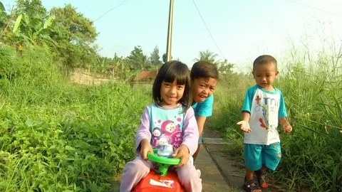 Southeast Asian Children playing toy car Stock Footage