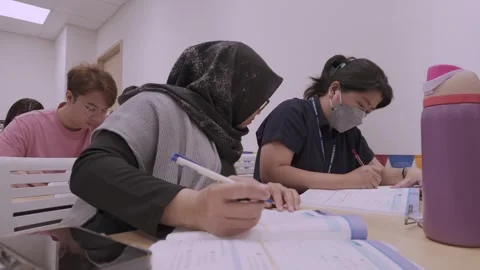 Southeast Asian Students Learning Traditional Chinese in Taiwan Classroom Stock Footage 340470992