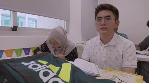 Southeast Asian Students Learning Traditional Chinese in Taiwan Classroom Stock Footage 340471037