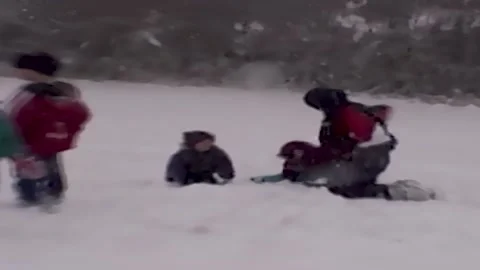 Southeastern Snowstorm 2002 close up kids playing in snow Stock Footage 164703210
