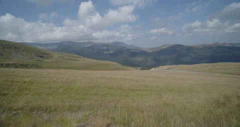 Southern Carpathians under blue cloudy sky 4K  slomo video Stock-Footage 266190448
