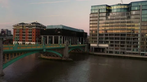 Southwark Bridge over Thames river and surrounding buildings Video stock 157435162