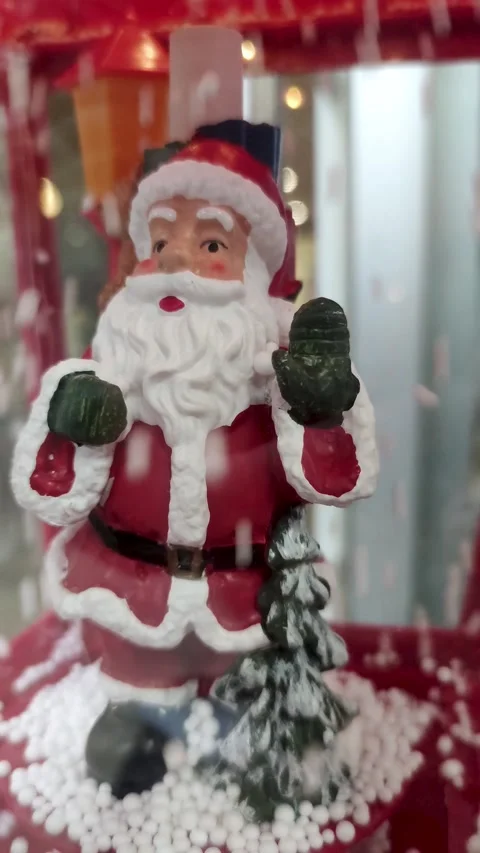 Souvenir Santa Claus in the Background of Falling Snow.  Stock Footage 221654675