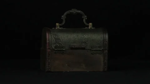 Souvenir trunk rotates on a black background loop Stock Footage 34660669