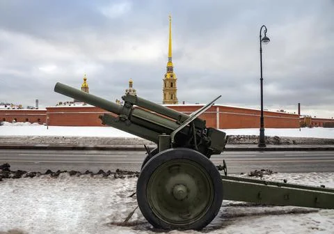 Soviet 122-mm howitzer model 1938 M-30 on the background of the Peter and Pau Stock Photos